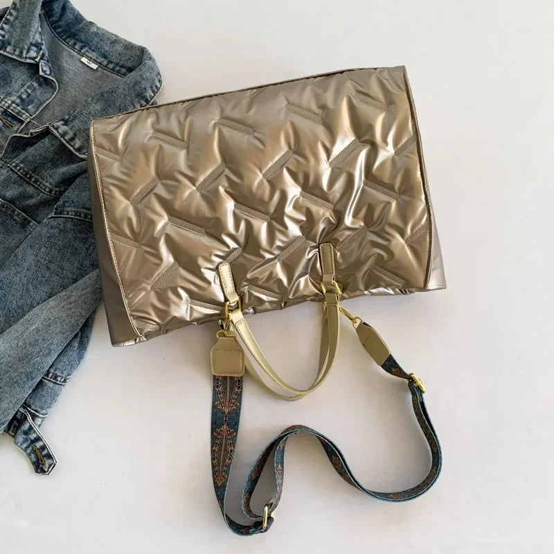 Stay on-trend with this fashion-forward large tote padded handbag featuring a designer quilted design. This stylish accessory is perfect for adding a touch of sophistication and elegance to your ensemble. -