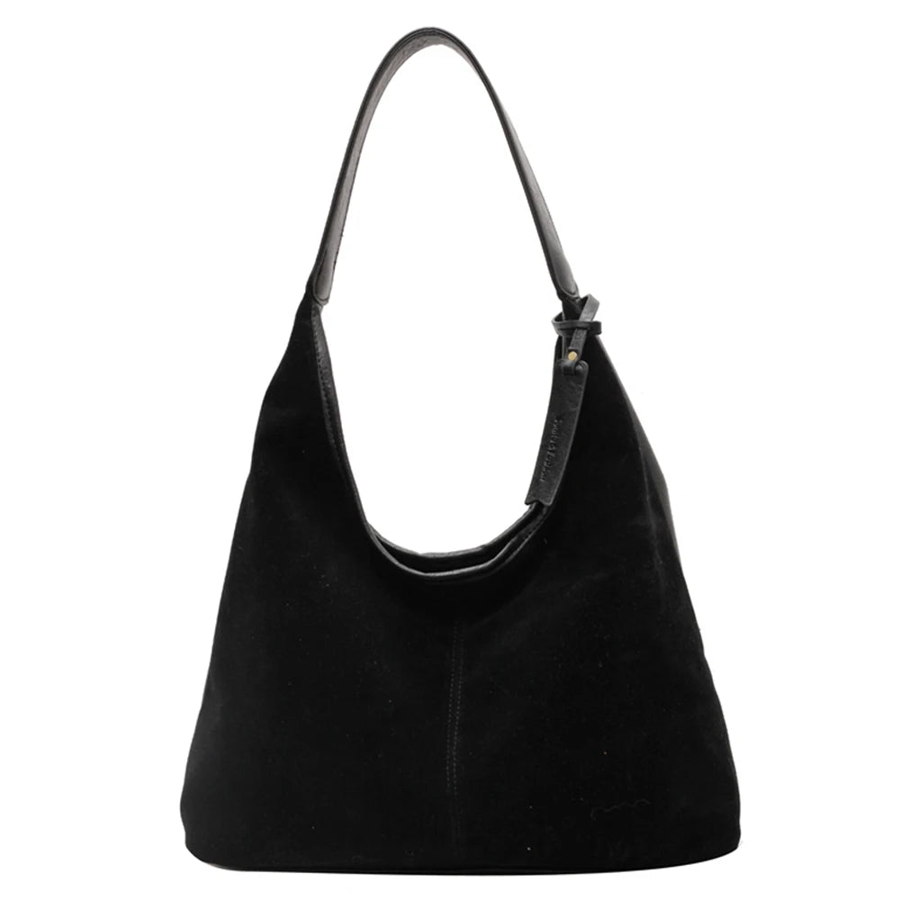 Elevate your style with this vintage shoulder bag, featuring a solid color design and large capacity. Perfect for the autumn-winter season, this handbag offers both fashion and functionality for your everyday essentials. -
