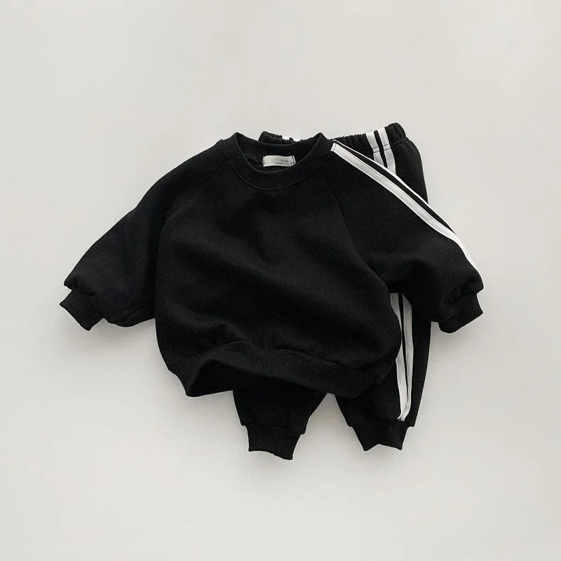 Keep your little one stylish and comfy with this cool two-piece baby suit—featuring a letter-printed zip-up top and matching leisure sports pants! -