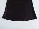 Elevate your elegance with this sleek black satin skirt for women—perfect for any occasion! -