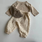 Keep your little ones comfy and cute in these organic cotton loose-fit baby pants—featuring playful tiger, bear, and floral prints perfect for boys and girls! -