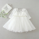 Make your baby girl shine in this elegant long-sleeve white party dress—perfect for special occasions! -