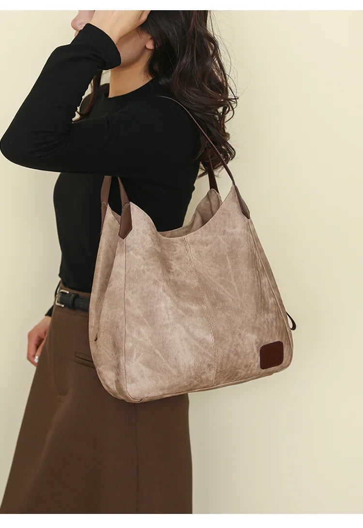 Stay organized and stylish with this large work tote bag for women. Designed with designer PU leather, this big bucket bag is perfect for carrying all your essentials in a chic and fashionable way. -