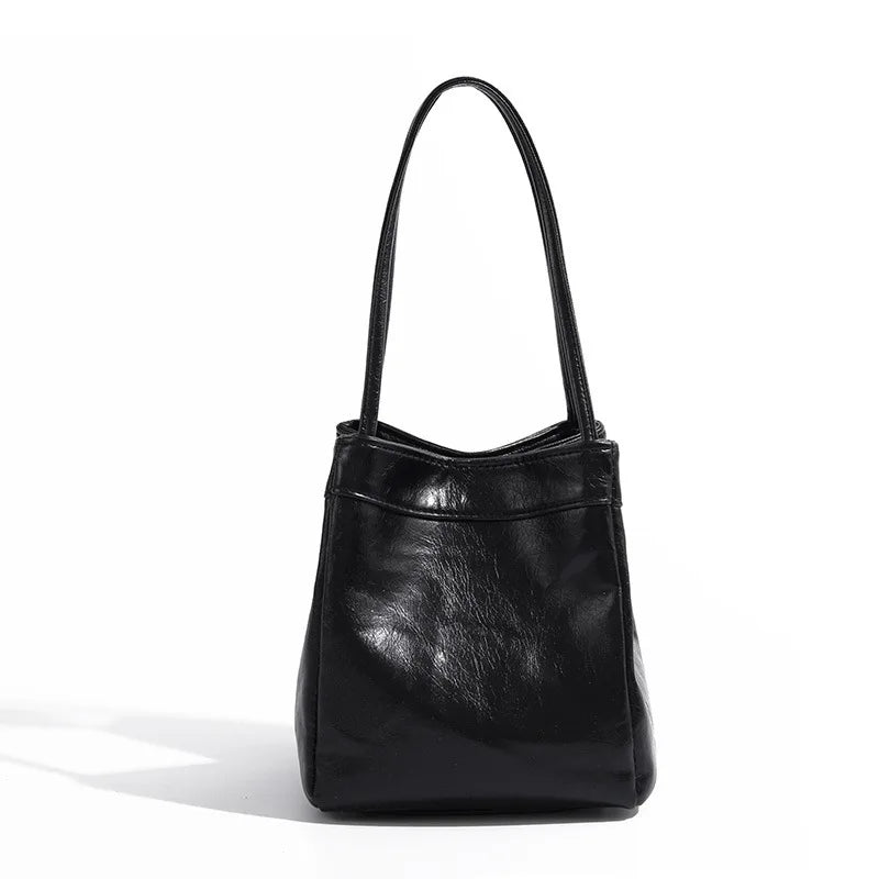 Stay on-trend with this bucket bag—a new fashion staple that offers simplicity, versatility, and a touch of classic style to elevate your wardrobe! -