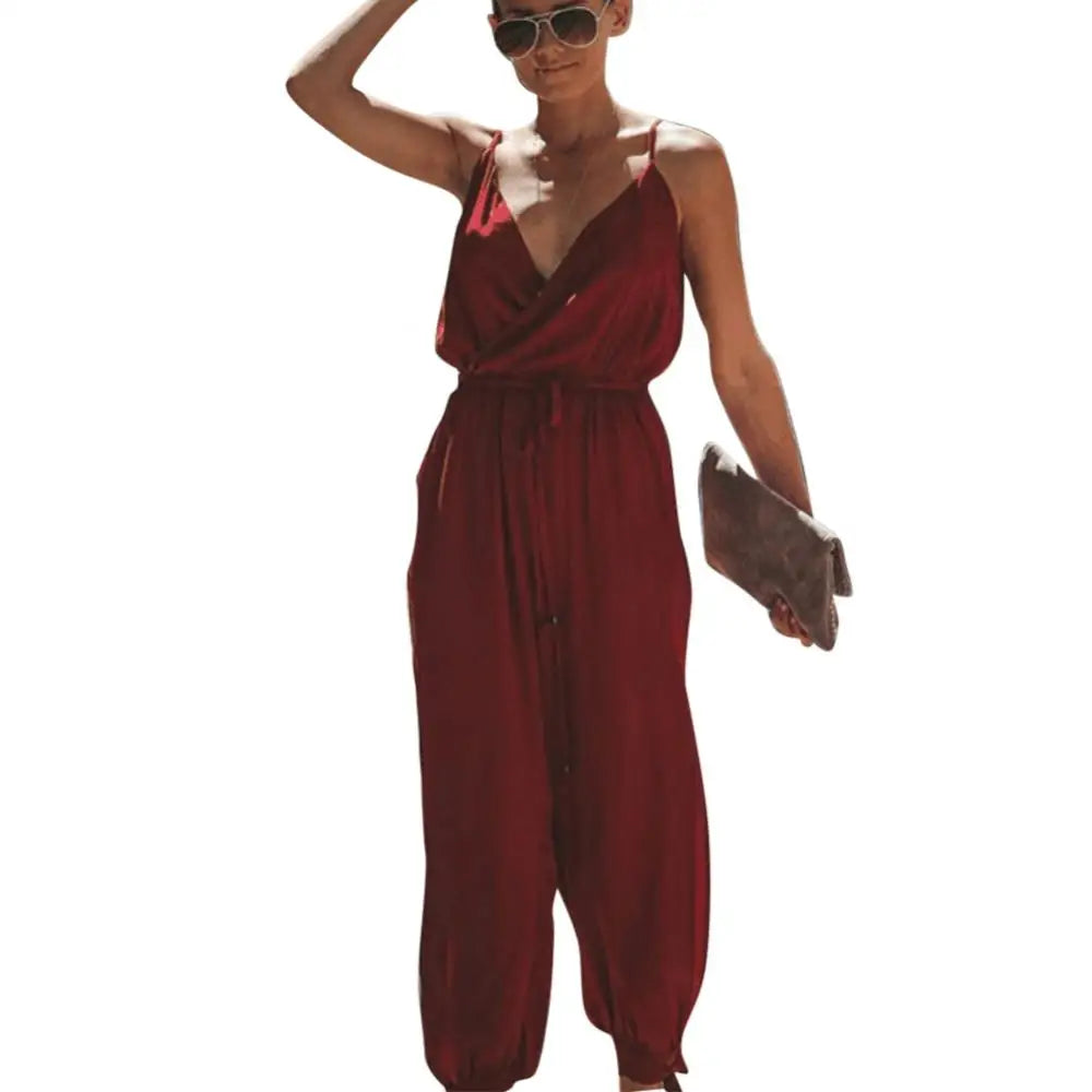 Dress to impress in this sexy and stylish women's summer jumpsuit. Featuring a backless design, deep V-neckline, floral print, and strappy details, this romper is perfect for making a statement with your outfit! -