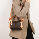 Make a statement with this luxurious and elegant box bag for women. Crafted from high-quality leather, this shoulder handbag features an elegant top-handle design, exuding sophistication and style for a classy finishing touch to your ensemble. -