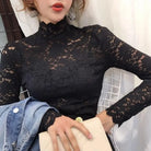 Achieve an elegant and feminine look with this long sleeve lace crochet top. The see-through design adds a touch of allure and sophistication to your outfit. -