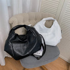 Make a stylish statement with these large shoulder bags designed for women. Crafted from soft leather, these fashionable handbags are perfect for adding a touch of sophistication to any outfit. -