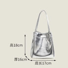 Stay on-trend with this bucket bag—a new fashion staple that offers simplicity, versatility, and a touch of classic style to elevate your wardrobe! -