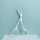 Eyebrow trimming scissors with built-in comb -