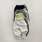 Keep your little one stylish and comfy with this cool two-piece baby suit—featuring a letter-printed zip-up top and matching leisure sports pants! -