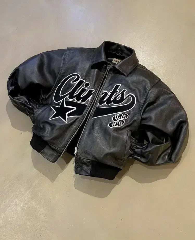 Make a bold fashion statement with this American vintage embroidered leather jacket. Inspired by hip-hop culture, this jacket adds a touch of edgy style to your wardrobe. -
