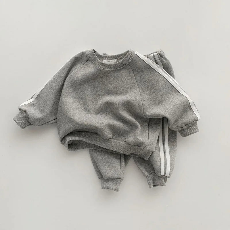 Keep your little one stylish and comfy with this cool two-piece baby suit—featuring a letter-printed zip-up top and matching leisure sports pants! -