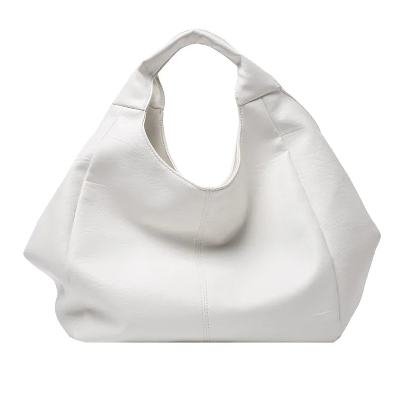 Make a stylish statement with these large shoulder bags designed for women. Crafted from soft leather, these fashionable handbags are perfect for adding a touch of sophistication to any outfit. -