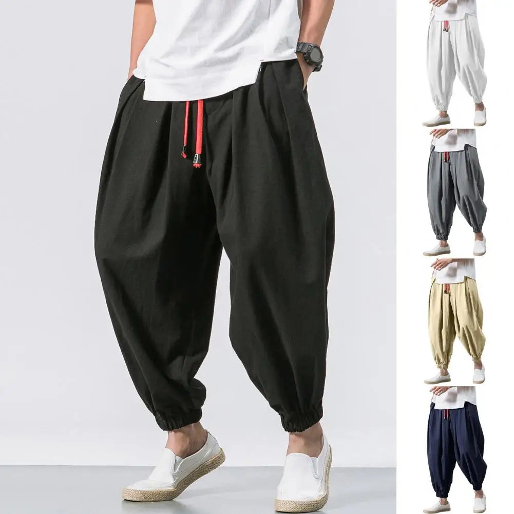 Stay comfortable and stylish in these men's baggy jogging pants featuring a drawstring waist—an ideal choice for a relaxed and casual look! -