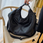 Make a stylish statement with these large shoulder bags designed for women. Crafted from soft leather, these fashionable handbags are perfect for adding a touch of sophistication to any outfit. -