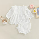 Keep your toddler cozy and cute in this 2-piece set featuring a solid color cutout round neck long sleeve top and matching bottoms—perfect for baby girls 3-24m! -
