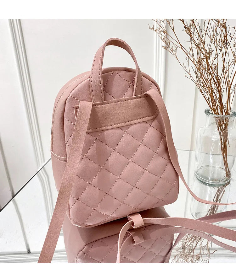 Carry your essentials in style with this fashionable women's bag. Featuring double pockets and embroidered details, this small book bag is perfect for adding a trendy touch to your outfit. -