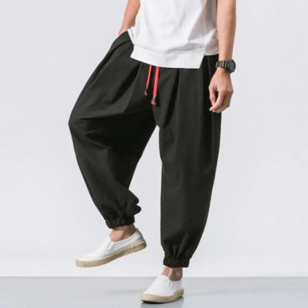 Stay comfortable and stylish in these men's baggy jogging pants featuring a drawstring waist—an ideal choice for a relaxed and casual look! -