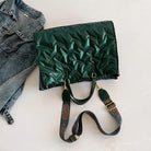 Stay on-trend with this fashion-forward large tote padded handbag featuring a designer quilted design. This stylish accessory is perfect for adding a touch of sophistication and elegance to your ensemble. -