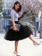 Add volume and elegance to your outfit with this knee-length underskirt—perfect for enhancing dresses and skirts for a fuller look! -