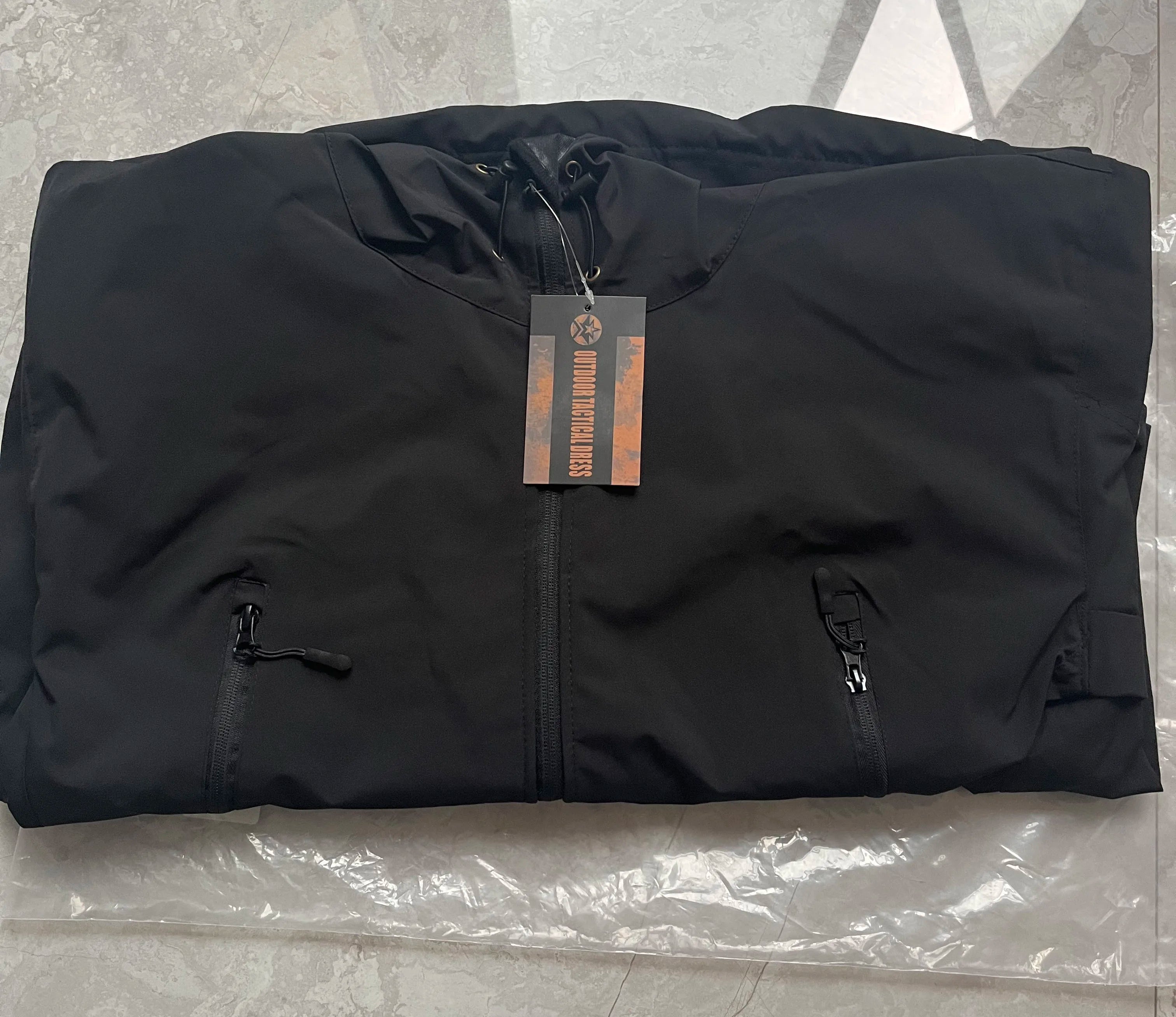 Stay prepared for any weather conditions with this tactical windproof and waterproof jacket for men. This versatile and durable jacket is perfect for outdoor activities and ensuring optimal protection from the elements. -