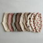 Keep your little ones comfy and cute in these organic cotton loose-fit baby pants—featuring playful tiger, bear, and floral prints perfect for boys and girls! -
