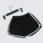 Stay comfortable and stylish with these elastic shorts for women. With a loose fit and quick-drying fabric, these shorts are perfect for active days or lounging at home. -