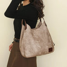 Stay organized and stylish with this large work tote bag for women. Designed with designer PU leather, this big bucket bag is perfect for carrying all your essentials in a chic and fashionable way. -