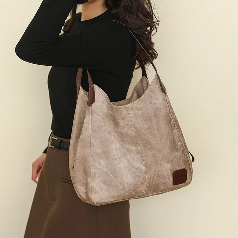 Stay organized and stylish with this large work tote bag for women. Designed with designer PU leather, this big bucket bag is perfect for carrying all your essentials in a chic and fashionable way. -