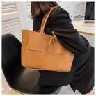 Make a fashion statement with this large capacity handbag. Crafted with stylish woven leather, this tote bag is perfect for adding a touch of elegance to your everyday outfit. -