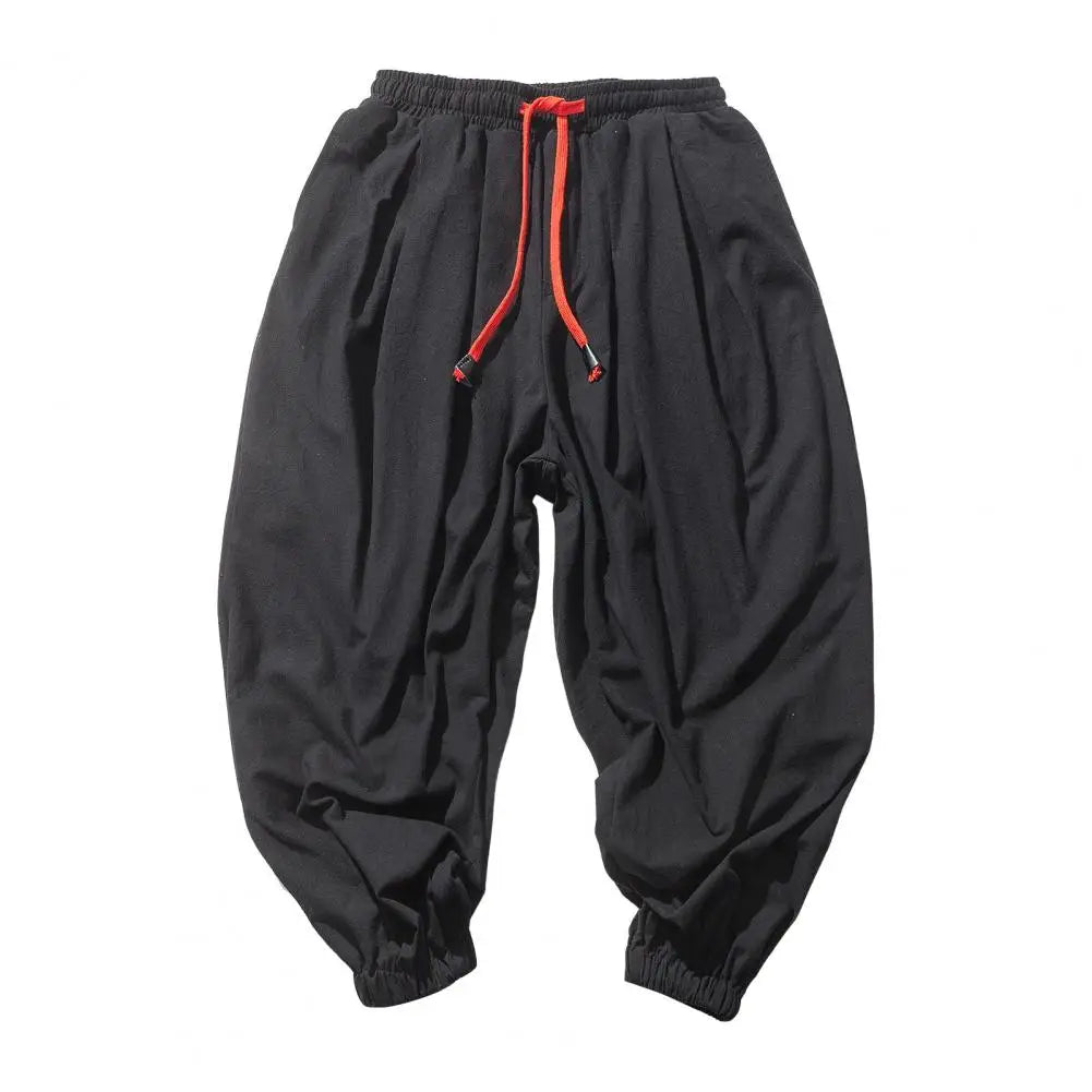 Stay comfortable and stylish in these men's baggy jogging pants featuring a drawstring waist—an ideal choice for a relaxed and casual look! -