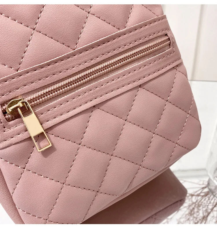 Carry your essentials in style with this fashionable women's bag. Featuring double pockets and embroidered details, this small book bag is perfect for adding a trendy touch to your outfit. -