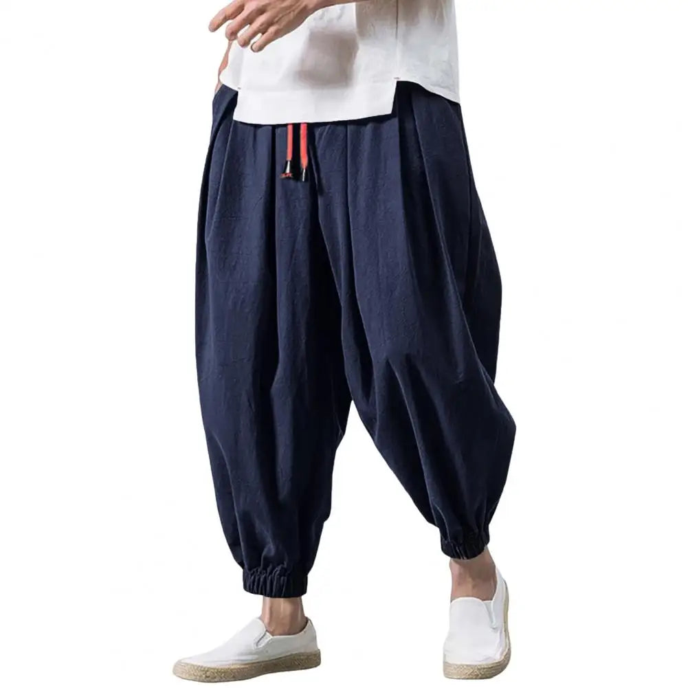 Stay comfortable and stylish in these men's baggy jogging pants featuring a drawstring waist—an ideal choice for a relaxed and casual look! -