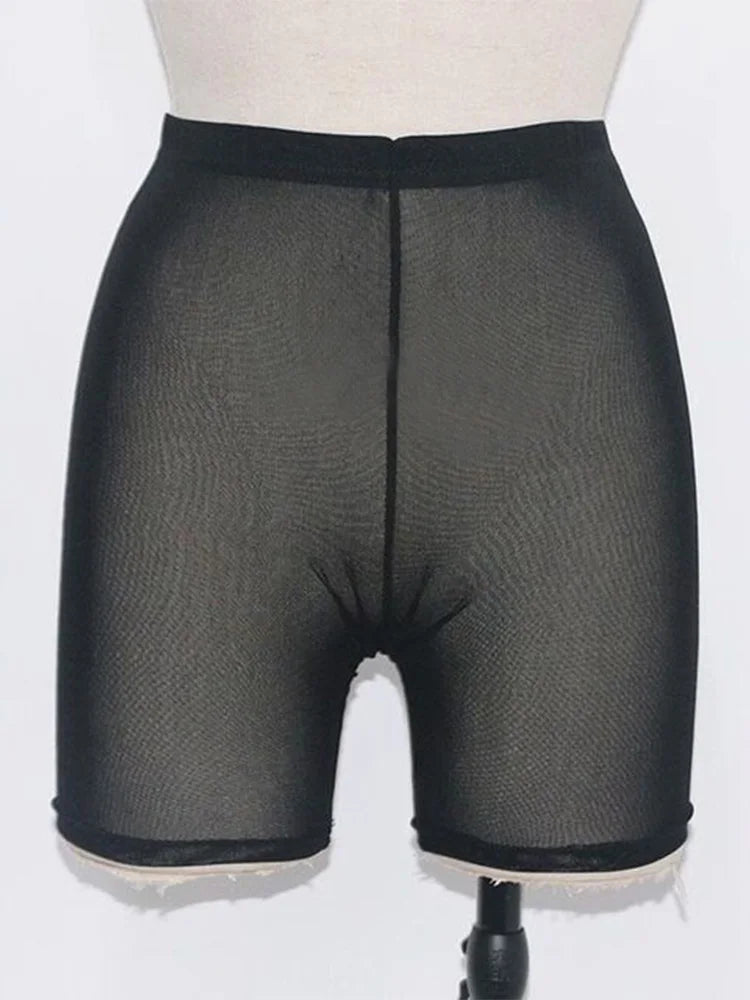 Stay stylish and comfortable with these yellow mesh transparent casual shorts for women—perfect for a fashionable and chic look! -