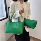 Make a fashion statement with this large capacity handbag. Crafted with stylish woven leather, this tote bag is perfect for adding a touch of elegance to your everyday outfit. -