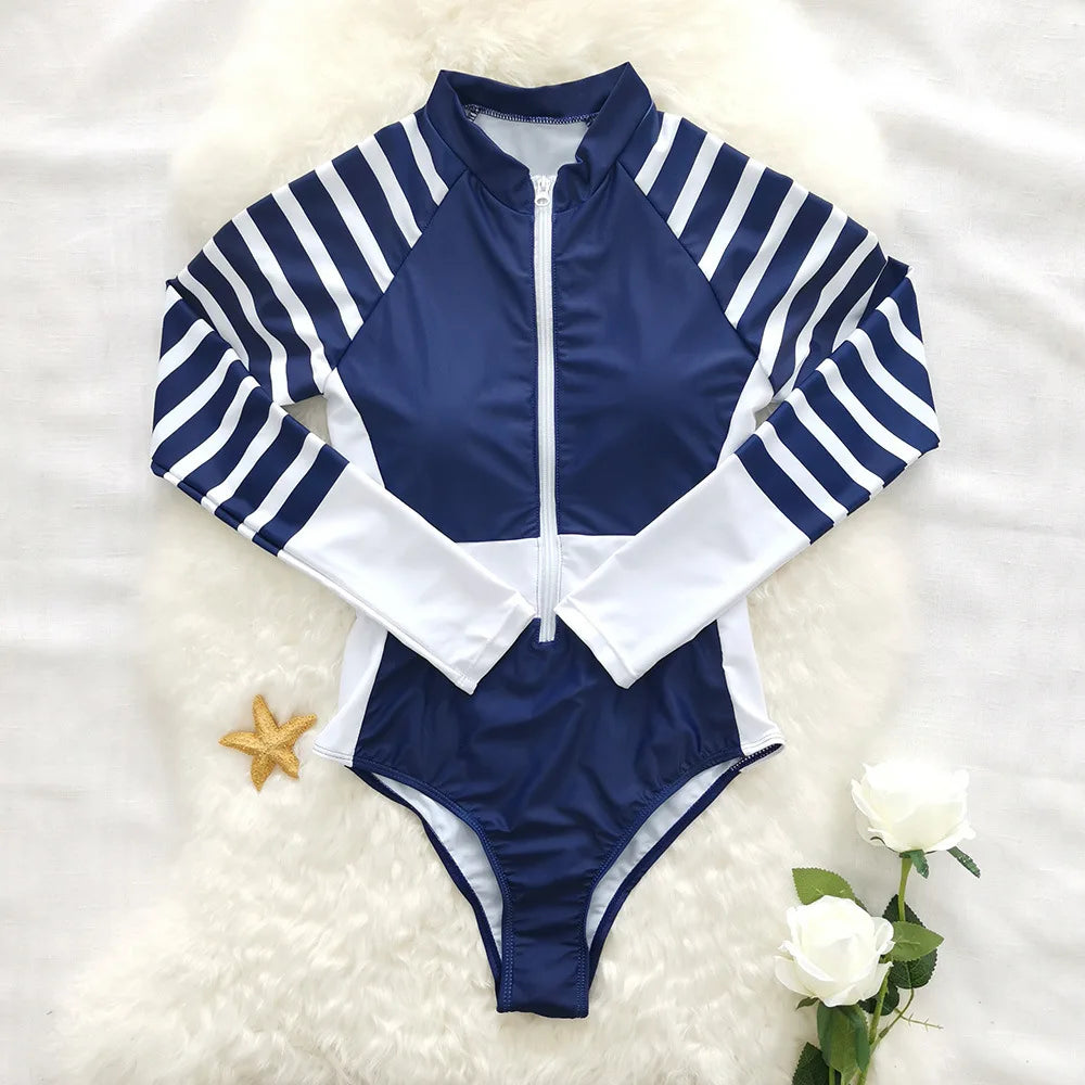 Stay stylish and protected from the sun in this long-sleeved one-piece swimwear for women! -