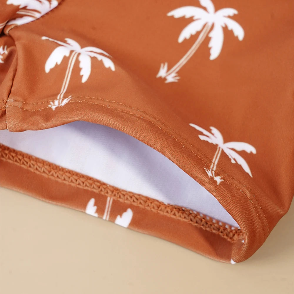 Make a splash in style with this fashionable and cute long-sleeve swimsuit for baby boys and girls—perfect for pool days and swim fun! -