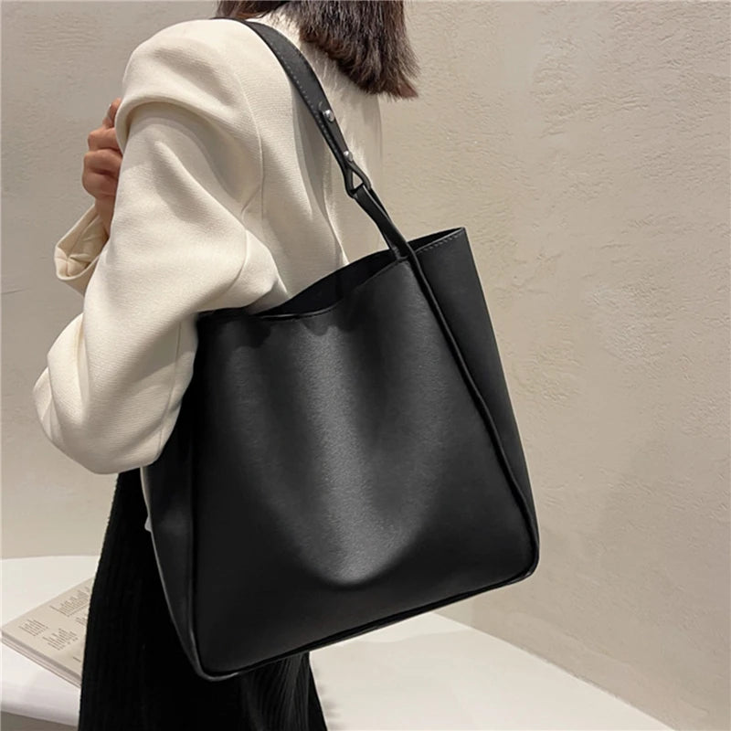 Elevate your style with these retro-inspired bucket shoulder bag made of real leather. -