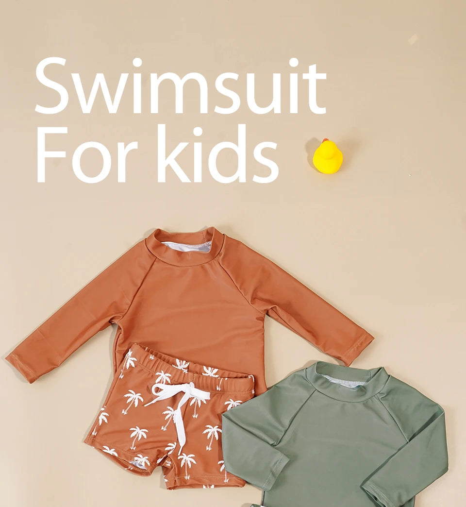 Make a splash in style with this fashionable and cute long-sleeve swimsuit for baby boys and girls—perfect for pool days and swim fun! -