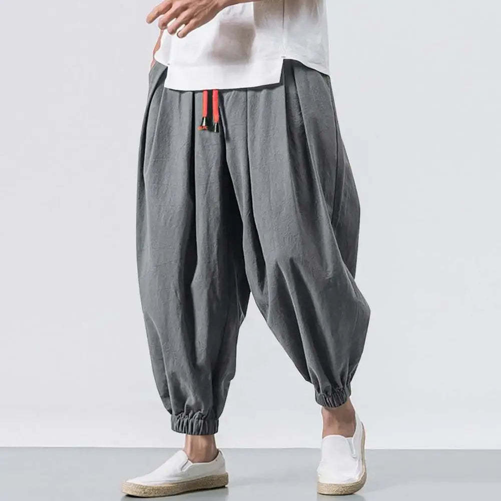 Stay comfortable and stylish in these men's baggy jogging pants featuring a drawstring waist—an ideal choice for a relaxed and casual look! -