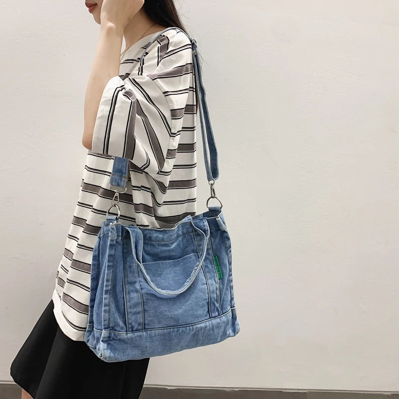 Elevate your casual look with this denim shoulder bag for women. Featuring a large design and zipper closure, this bag is perfect for shopping and everyday use, adding a touch of style to your outfit. -