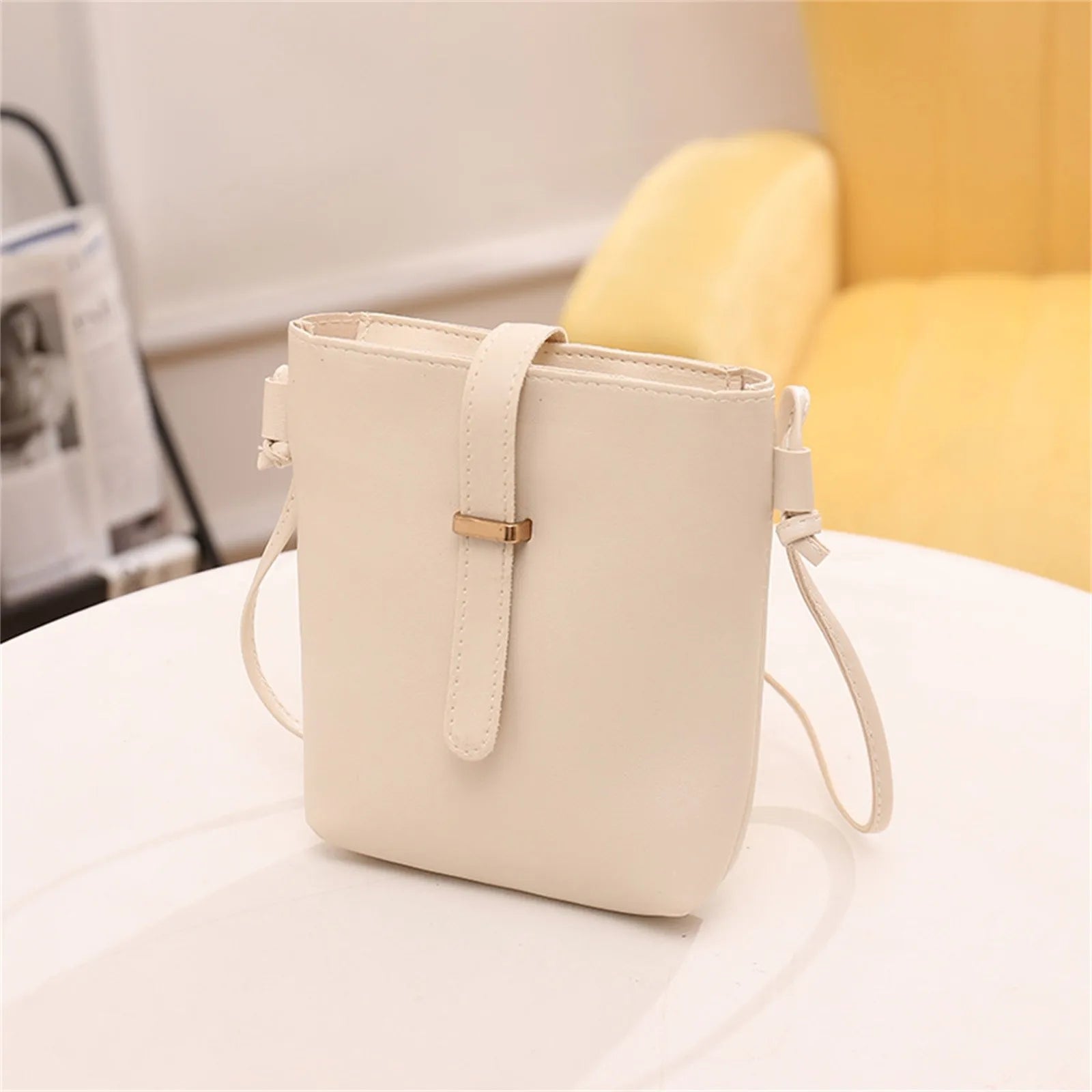 Stay on trend with this fashionable drawstring lady bag, featuring a stylish cross-border design and casual letter detail. Perfect for adding a chic and trendy touch to your outfit! -