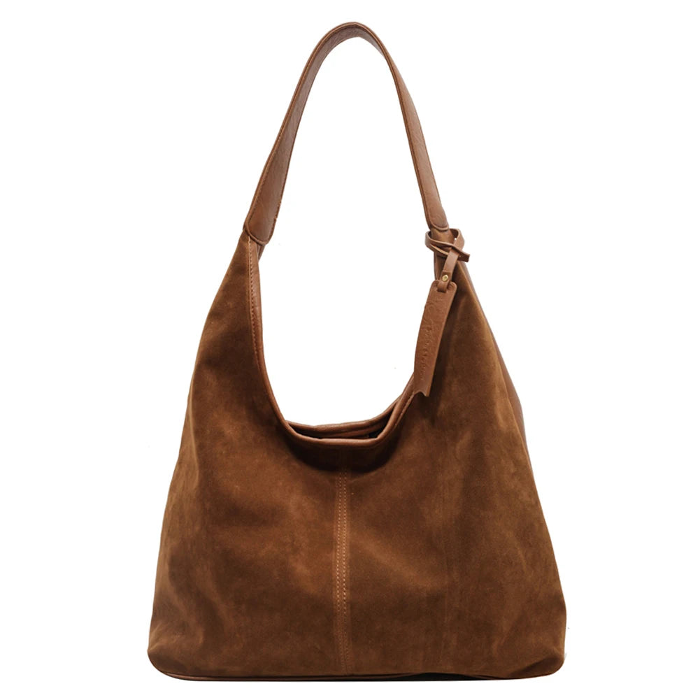 Elevate your style with this vintage shoulder bag, featuring a solid color design and large capacity. Perfect for the autumn-winter season, this handbag offers both fashion and functionality for your everyday essentials. -