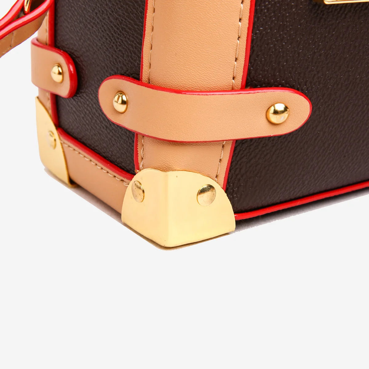 Make a statement with this luxurious and elegant box bag for women. Crafted from high-quality leather, this shoulder handbag features an elegant top-handle design, exuding sophistication and style for a classy finishing touch to your ensemble. -