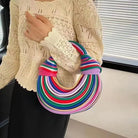 Make a statement with this gold luxury designer brand handwoven noodle bag. With a rope-knotted hobo design and a chic silver evening clutch, this bag is the epitome of high fashion and sophistication. -