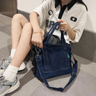 Elevate your casual look with this denim shoulder bag for women. Featuring a large design and zipper closure, this bag is perfect for shopping and everyday use, adding a touch of style to your outfit. -