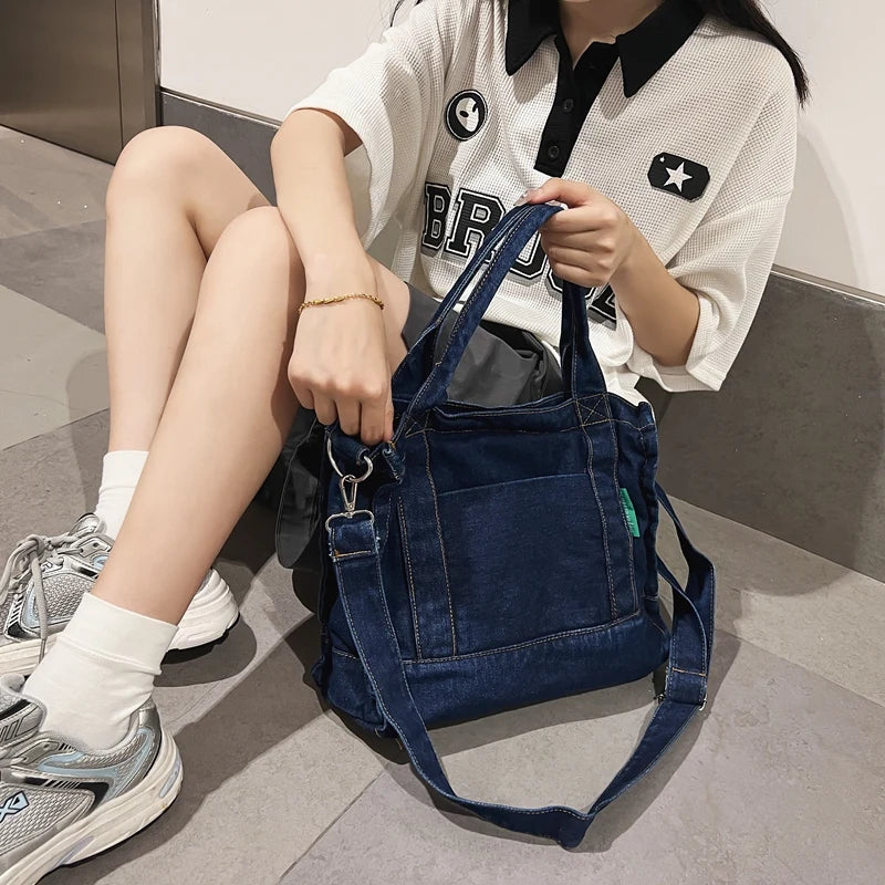 Elevate your casual look with this denim shoulder bag for women. Featuring a large design and zipper closure, this bag is perfect for shopping and everyday use, adding a touch of style to your outfit. -