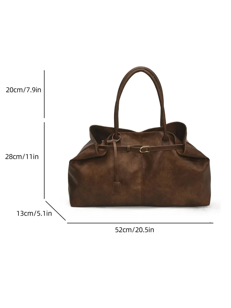 Carry your essentials in style with this women's tote bag. Featuring a large capacity, soft leather construction, and retro casual design, this versatile handbag is perfect for daily use and adds a touch of sophistication to your outfit. -