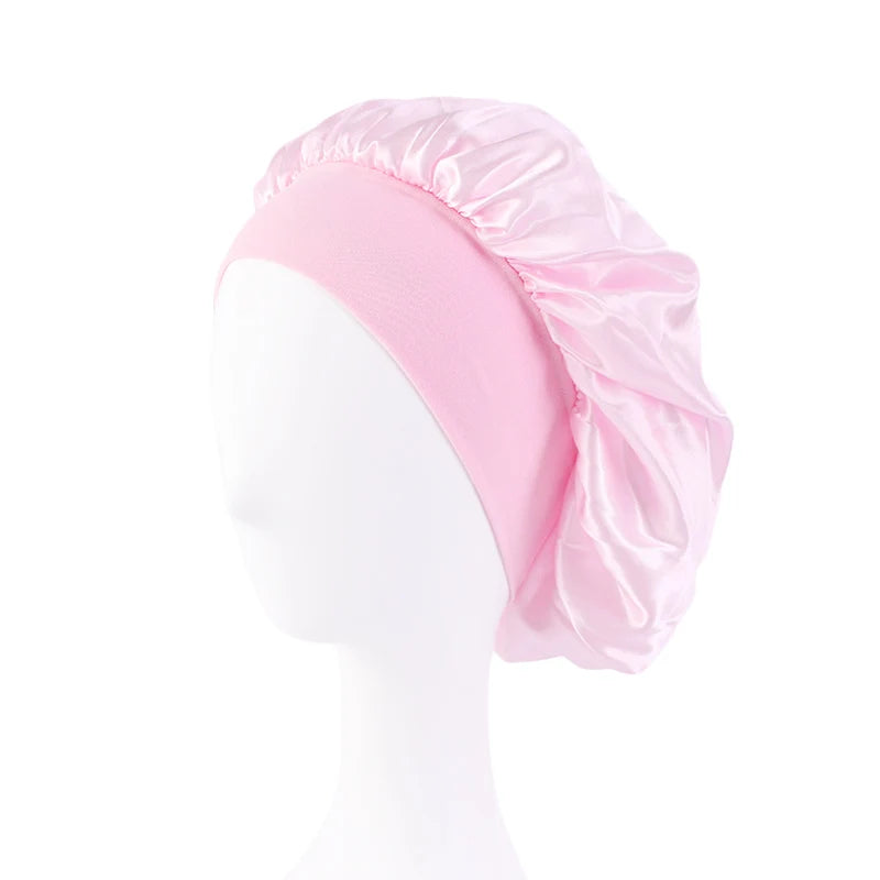 Protect your hair in style with these satin solid bonnets. Featuring a wide-brim design, these hats are perfect for night sleeping or bathing and are suitable for both men and women. -
